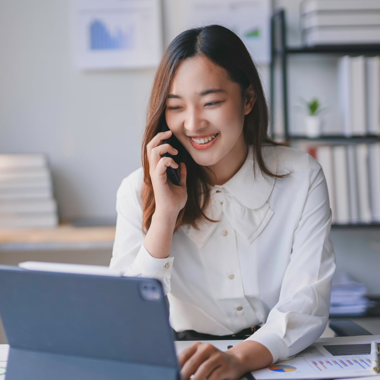 account manager on the phone with laptop