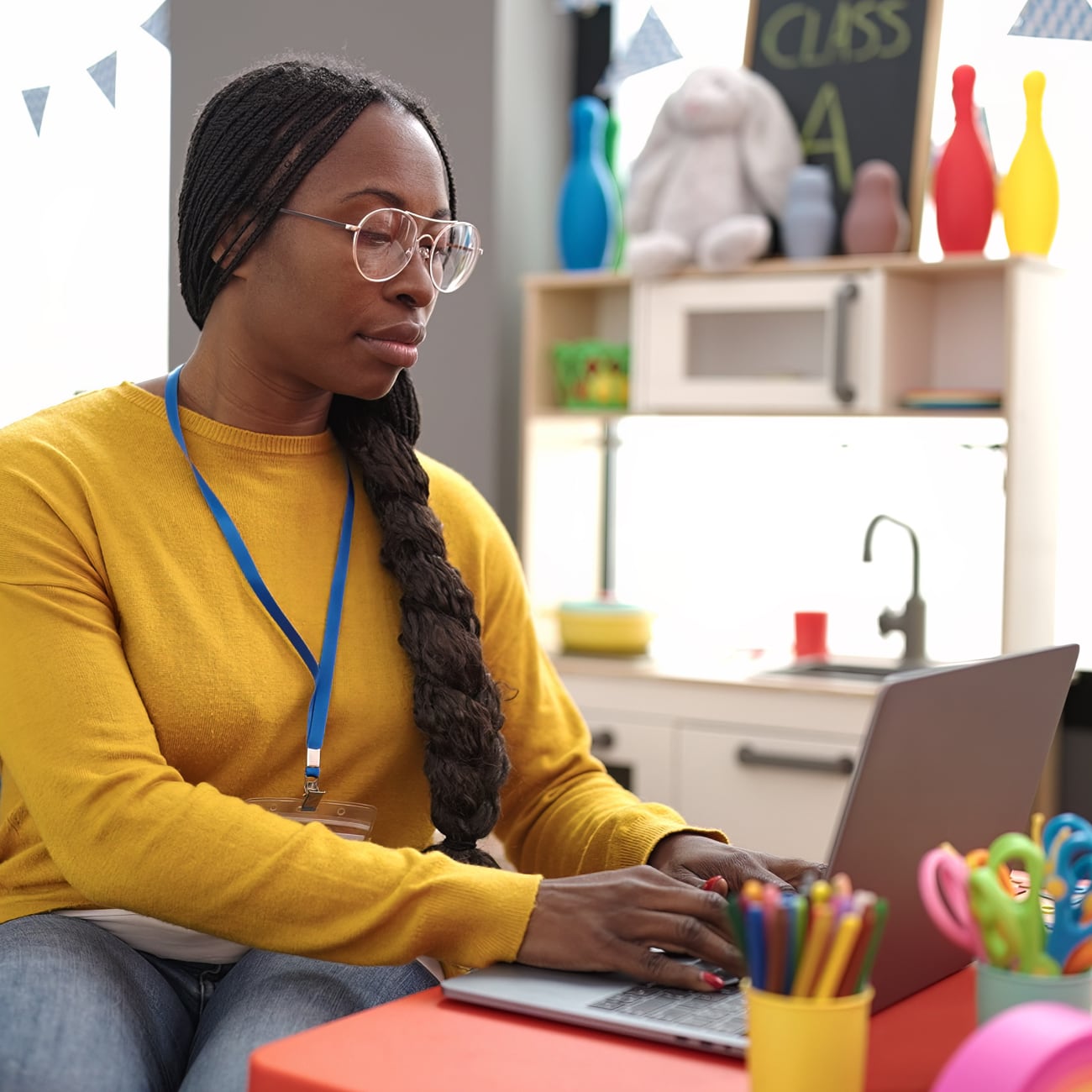 early child educator on laptop