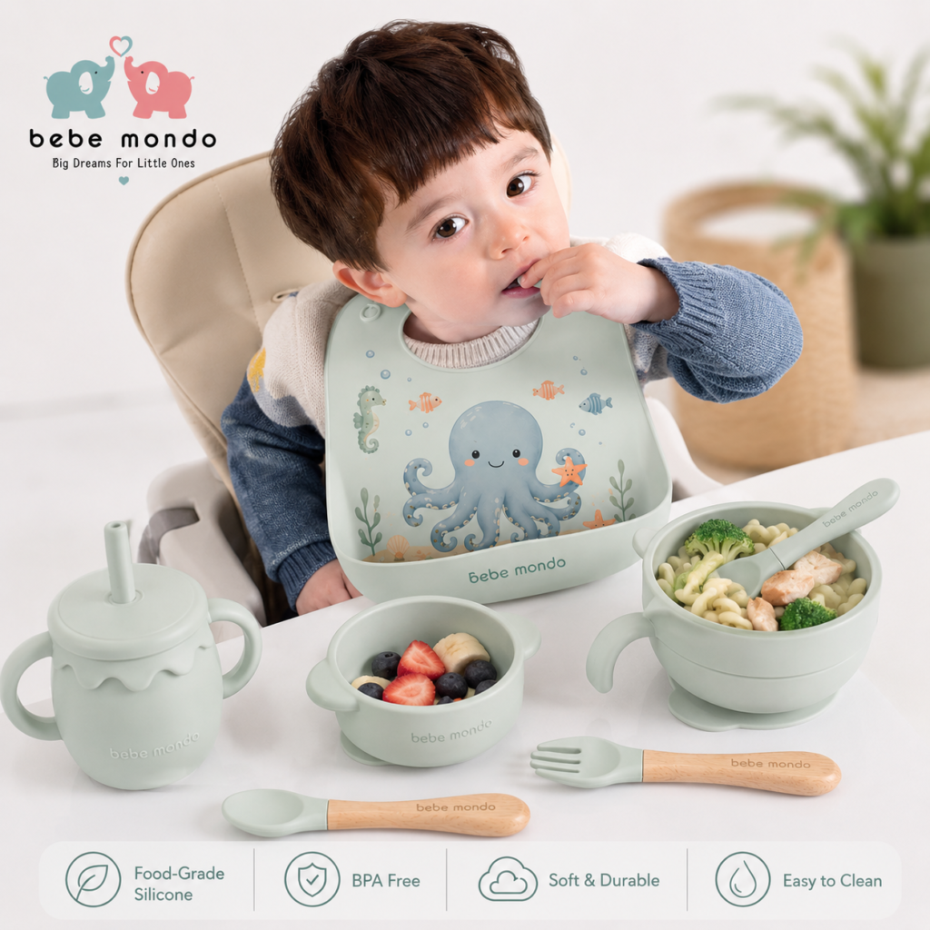 baby is eating lunch in a beautiful baby silicone plate and feeding set with octopus baby bib new color